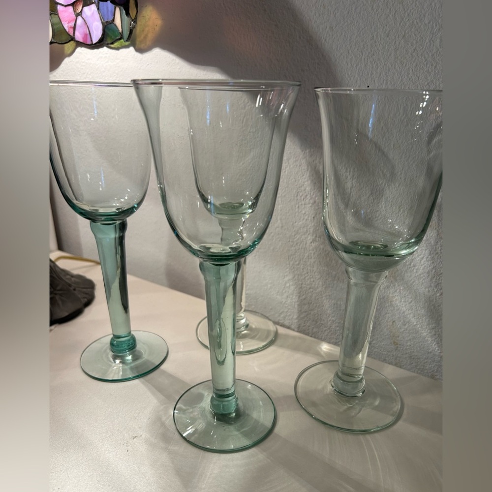 4 green, hand blown glasses. 8.75”